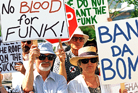 Above: Anti-funk demonstrators protest George Clinton's plan to drop Da Bomb on Baghdad.